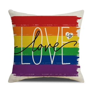 Detail of linen texture pillowcase with LOVE is love rainbow print and heart motif