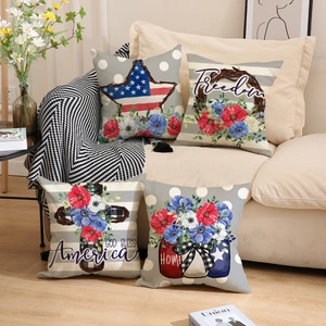Set of 4 patriotic Independence Day pillow covers with flag motifs on a beige sofa