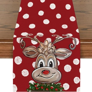 Red Christmas linen table runner featuring white polka dots and a cute cartoon reindeer