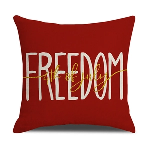 Detail of red linen pillowcase with Freedom and 4th of July text and woven texture