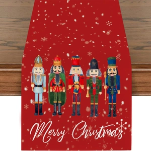 Red Christmas table runner featuring nutcracker soldiers and Merry Christmas lettering