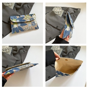 Detail of floral sequin embroidery on high-quality envelope clutch and internal lining