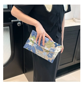 Detailed embroidery and sequins on this elegant floral envelope evening clutch bag