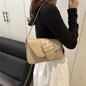 Minimalist apricot leather shoulder bag with stylish gold buckle and adjustable strap
