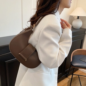 Coffee brown leather crescent underarm bag with adjustable strap and gold hardware