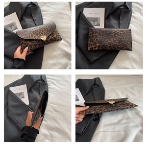 Detailed view of leopard print envelope clutch featuring a gold irregular metal clasp