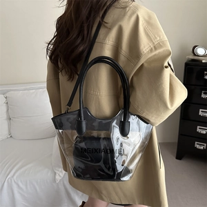 Minimalist transparent PVC tote bag with black inner pouch and round handles