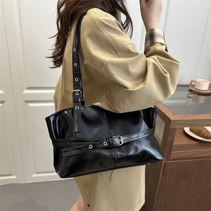 Retro black oiled leather shoulder bag for women featuring a spacious tote design