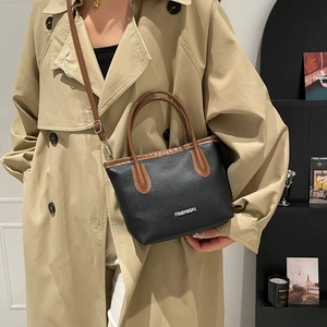 Chic black and brown leather tote bag with silver FASHION lettering for autumn women style