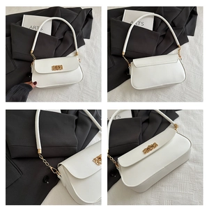 Detail view of white leather crossbody bag showing gold buckle and fine stitching