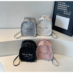 Detailed display of mini dual-zipper backpacks in silver, white, black, and pink colors