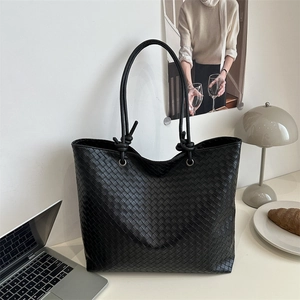 Classic black woven tote bag with knotted shoulder straps for office and casual commute