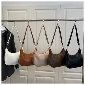 Retro hobo dumpling bags in five colors hanging on a rack for the 2025 autumn collection