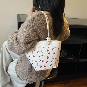 Korean style white bucket bag with red cherry print and stylish knotted shoulder strap