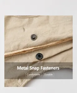 Detail of high-quality metal magnetic snap button on beige pleated tote bag fabric