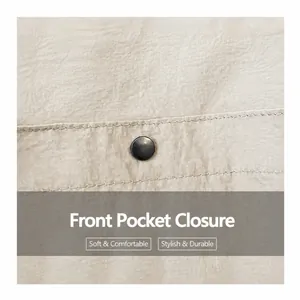 Detail of metal snap button closure and ruched fabric texture on beige tote bag