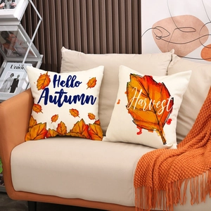 Set of two autumn throw pillow covers featuring Hello Autumn and Harvest maple leaf designs