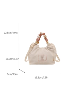 Chic beige crossbody handbag with artistic marble-effect beaded handle and cute bear print