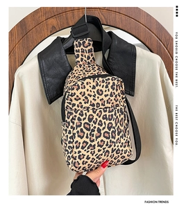 Detail of leopard print nylon chest bag with adjustable strap and front zipper pocket