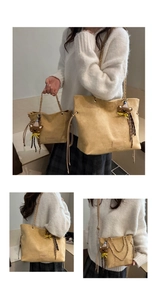 Detail of camel suede tote bags with metal chains and cute teddy bear pendants
