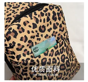 Close-up of leopard print chest bag showing durable fabric and front zipper pocket