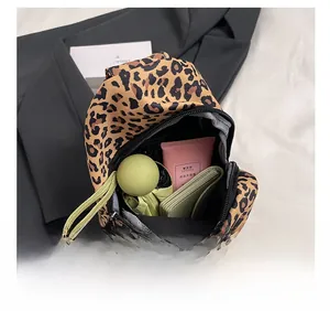 Detailed interior of leopard print crossbody bag showing spacious capacity and storage