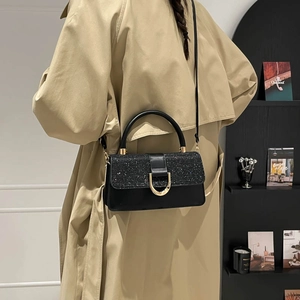 Classic black sequin shoulder bag for women with gold clasp and elegant khaki trench coat