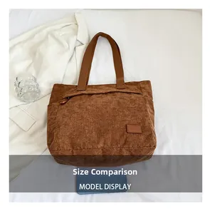 Size comparison of coffee brown corduroy tote bag showing hidden zipper pocket and texture