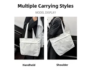 Detailed texture of white corduroy tote bag with long handles and decorative patch