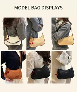 Fashionable half-moon underarm bag with lychee texture and cherry charm accessory