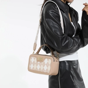 Chic quilted crossbody camera bag with contrast stitching and adjustable wide strap
