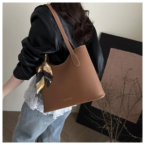 Brown leather tote bag with silk scarf detail and FASHION & BAGS logo shown on shoulder