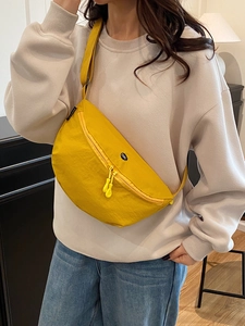 Elegant yellow nylon half-moon crossbody bag with OK patch and zipper for daily casual use