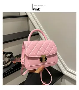 Pink quilted crossbody bag with gold twist lock shown in a lifestyle setting