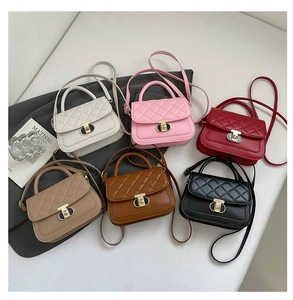 Top view of quilted leather crossbody bags in six colors with gold twist locks