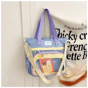 Détail du sac cabas oreilles de chat multicolore avec poche PVC et cartes de dessins