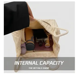 Interior view of the large capacity straw tote showing main space and zipper pocket