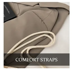 Detail of soft cream woven cotton rope handle on a textured straw tote bag