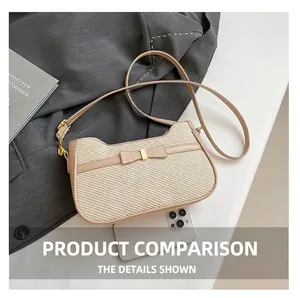 Detail of beige woven textured handbag with leather bow detail on grey blazer backdrop