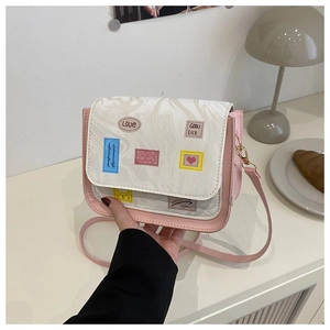 Detail of pink and white marble textured flap bag with colorful decorative patches