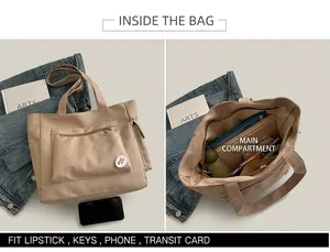 Detail view of large beige canvas tote bag showing spacious interior and front zipper pocket