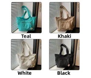 Collage of four nylon tote bags in blue, khaki, white, and black with front zipper pockets