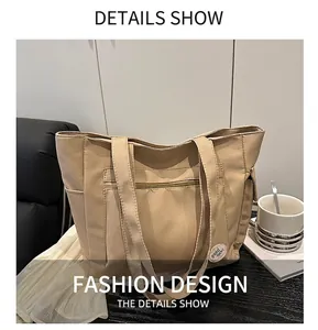 Detail showing high-density beige canvas tote with front zip pocket and side slots