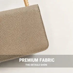 Close-up of premium woven texture fabric with metallic champagne finish and gold hardware