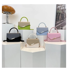 Multi-colored handbags with woven flap texture and smooth leather finish on display