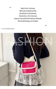 Detail of fuchsia croc-effect crossbody bag with cream bow and silver buckle detail