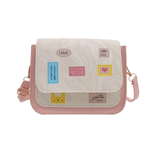 Cute marble leather crossbody bag in cream and pink with cartoon badges and adjustable strap