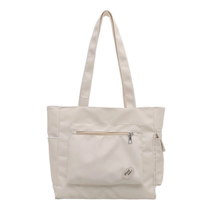 Minimalist beige tote bag with a front zipper pocket and good luck label for daily commute