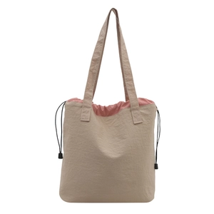 Vintage retro drawstring tote bag in beige with pink lining and adjustable shoulder straps
