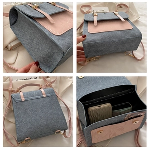 Detail view of pink and grey backpack featuring pearl handle and retro metal hardware